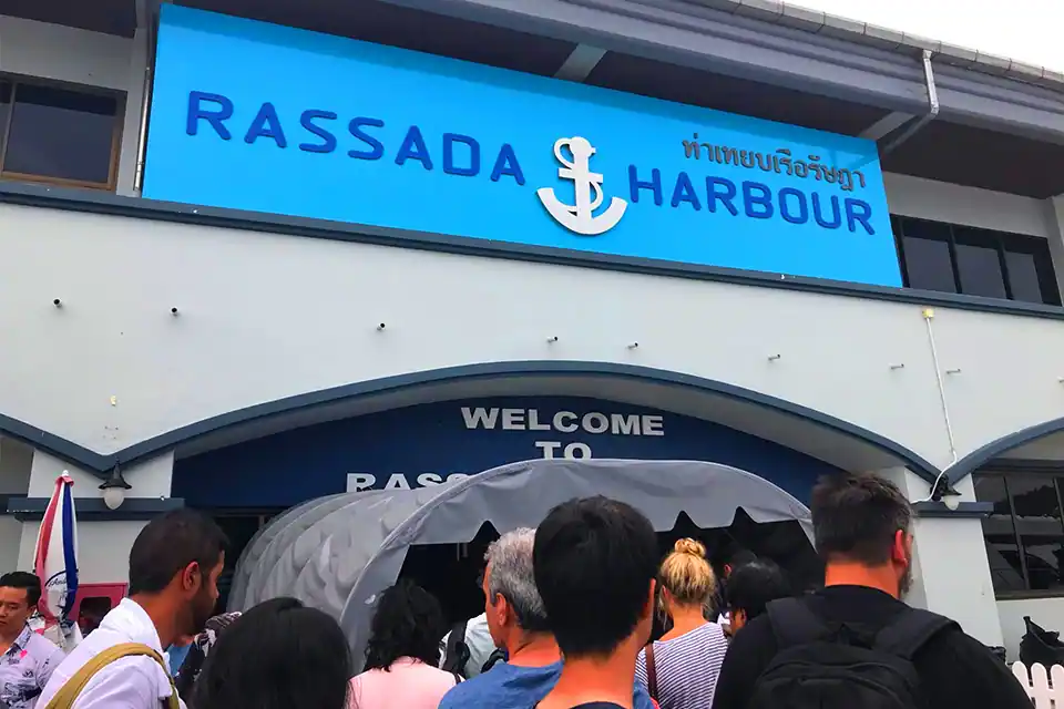Passengers queuing at the main entrance of the Rassada Harbour passenger terminal in Phuket to check in for their ferry departures